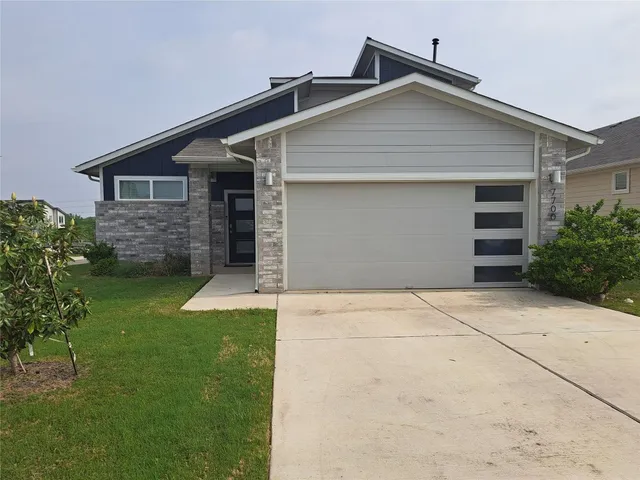 front view of house with a yard