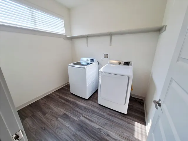 a view of a room with a floor to ceiling window