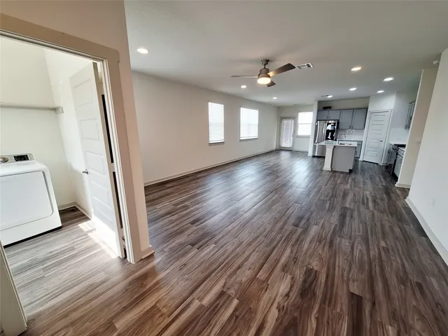 a view of a living room and hardwood floor