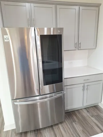 a kitchen with a sink a microwave a stove and refrigerator