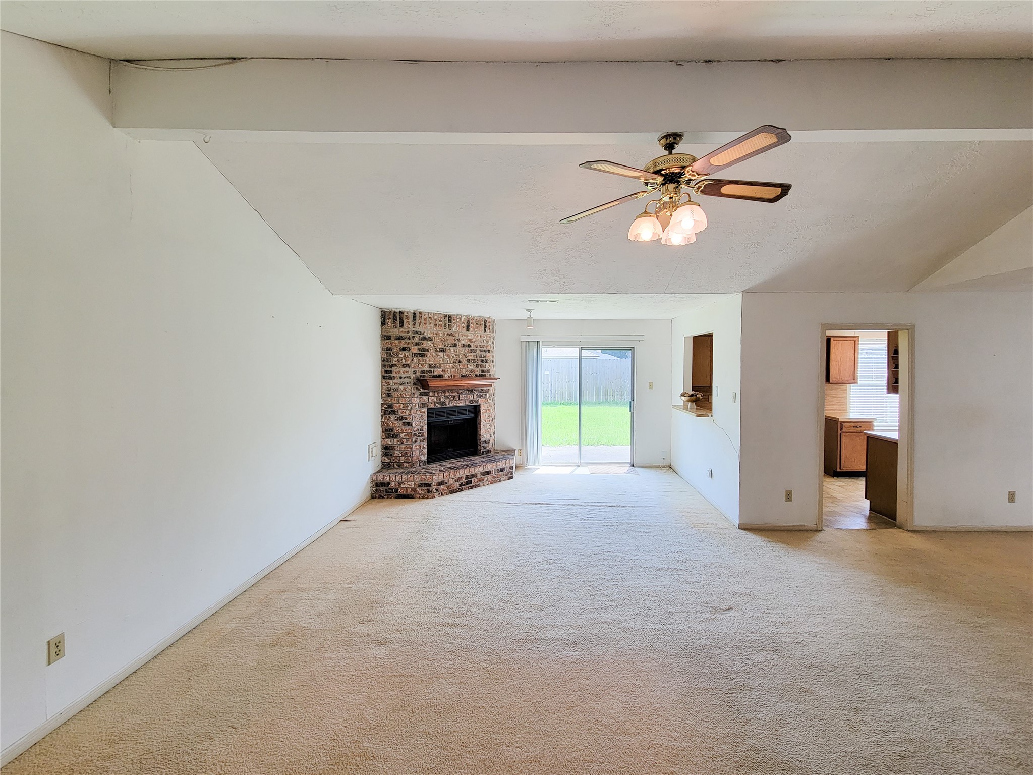 23211 Timberbrook Drive Spring, TX 77373 - Photo 5 of 34 a view of a livingroom with a fireplace and a chandelier fan