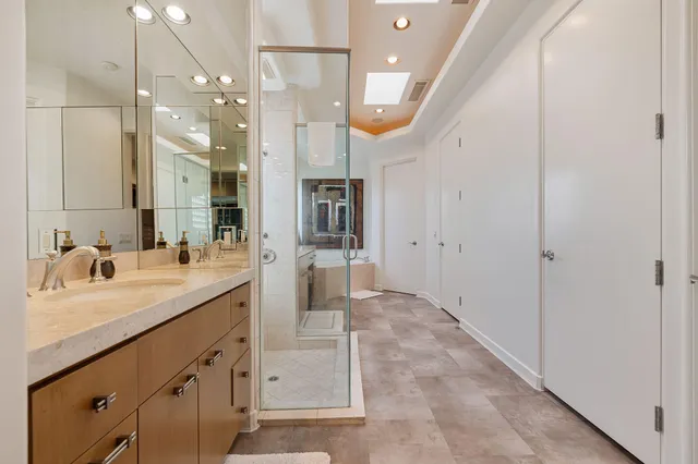 a large bathroom with a glass shower door