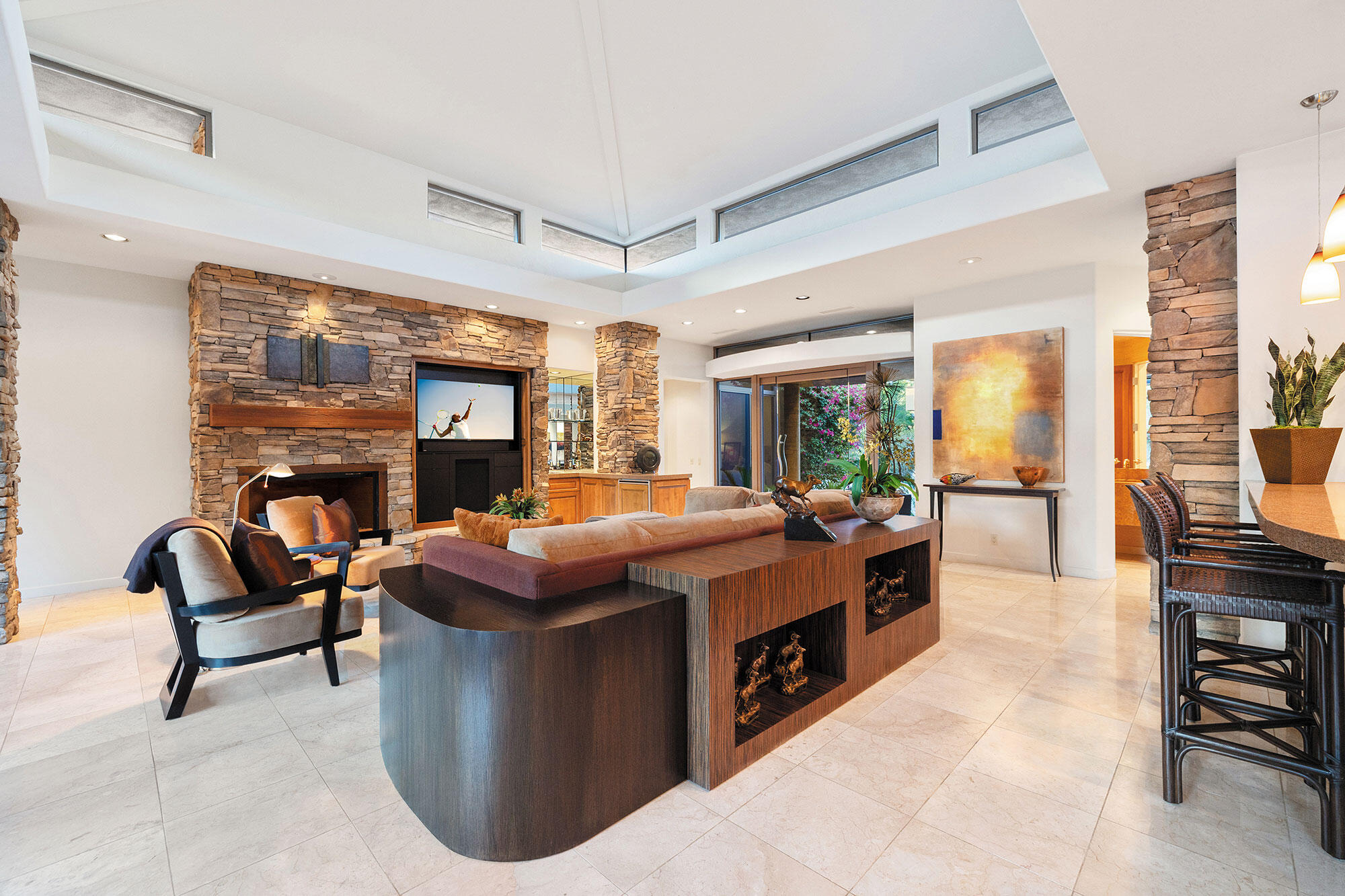 1134 Lake Vista Palm Desert, CA 92260 - Photo 3 of 14 a living room with fireplace furniture and a large window