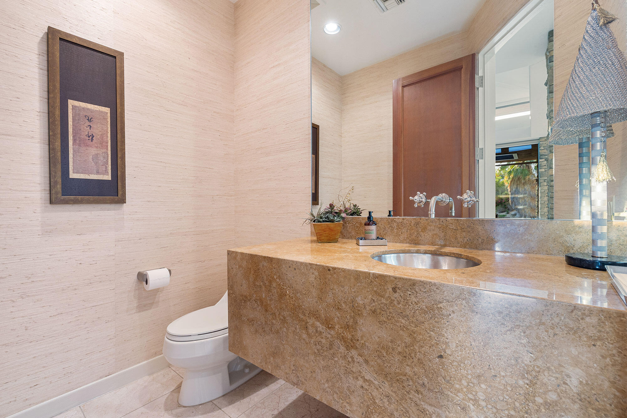 1134 Lake Vista Palm Desert, CA 92260 - Photo 7 of 14 a bathroom with a toilet sink and mirror