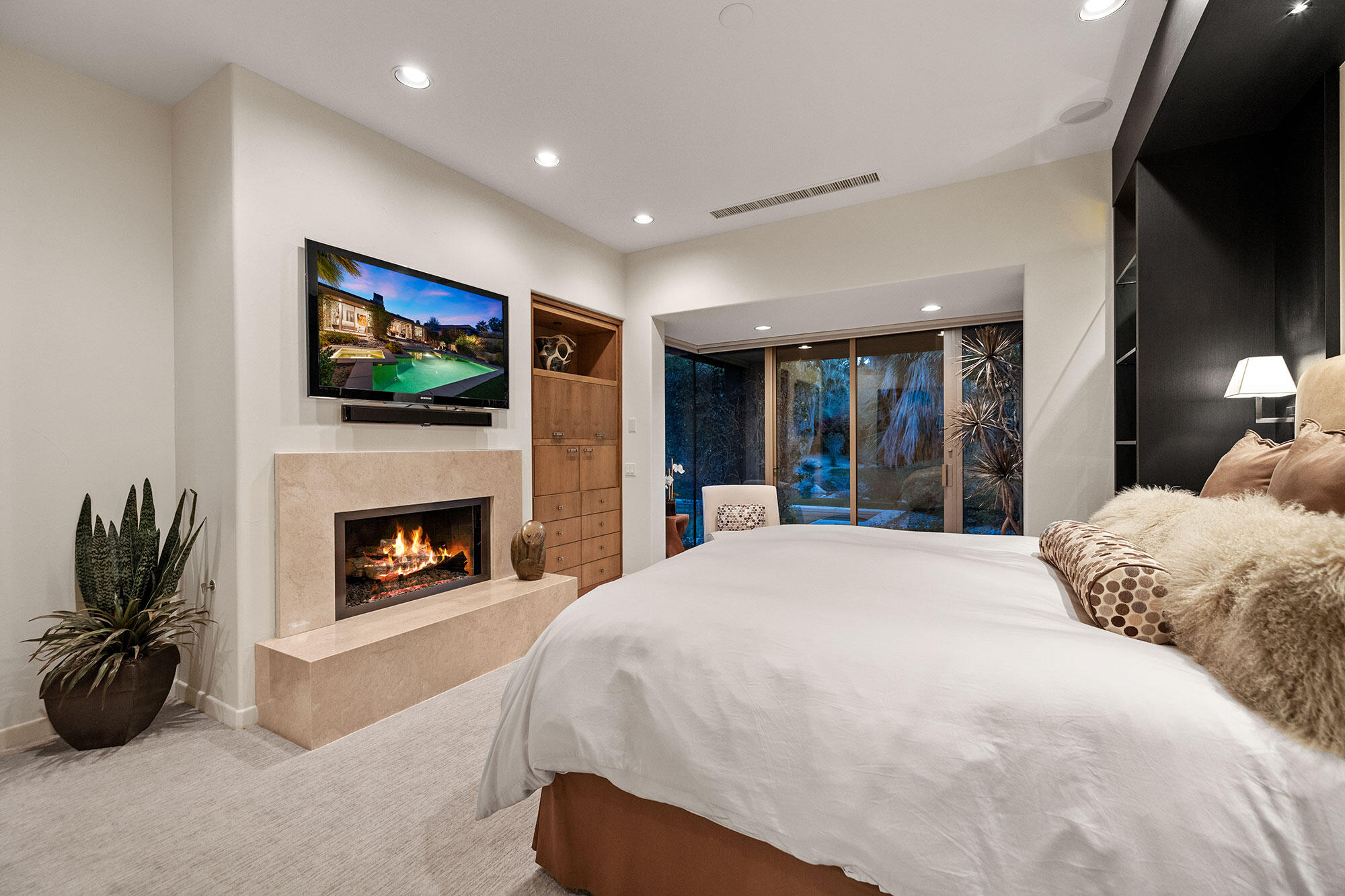 1134 Lake Vista Palm Desert, CA 92260 - Photo 10 of 14 a spacious bedroom with a bed and a flat screen tv