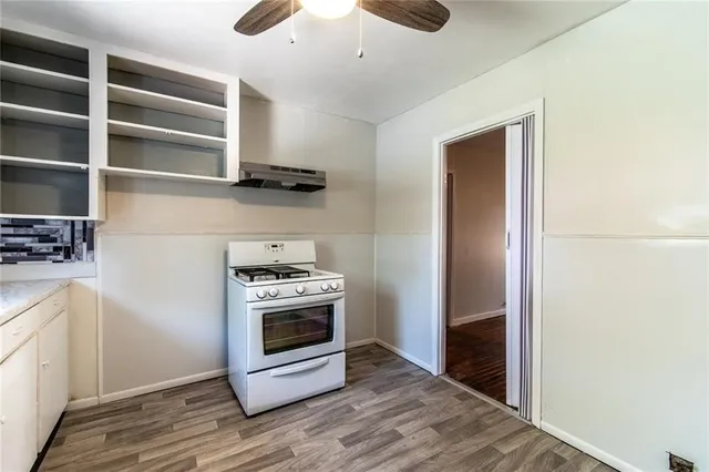a kitchen with a stove and a refrigerator