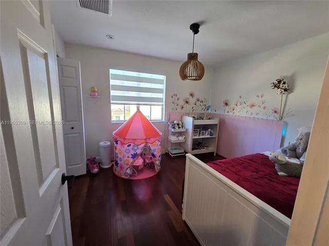 a bed room with a bed and a window