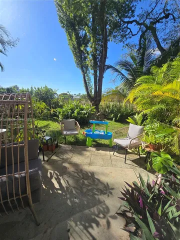 a bench is sitting in the middle of a yard