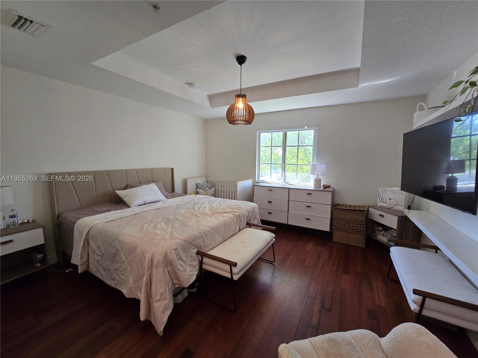 738 Northeast 90th Street, Unit 207 Miami, FL 33138 - Photo 7 of 19 a bedroom with a bed and window