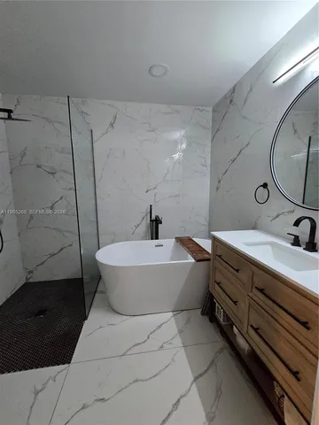 a bathroom with a bathtub sink and toilet
