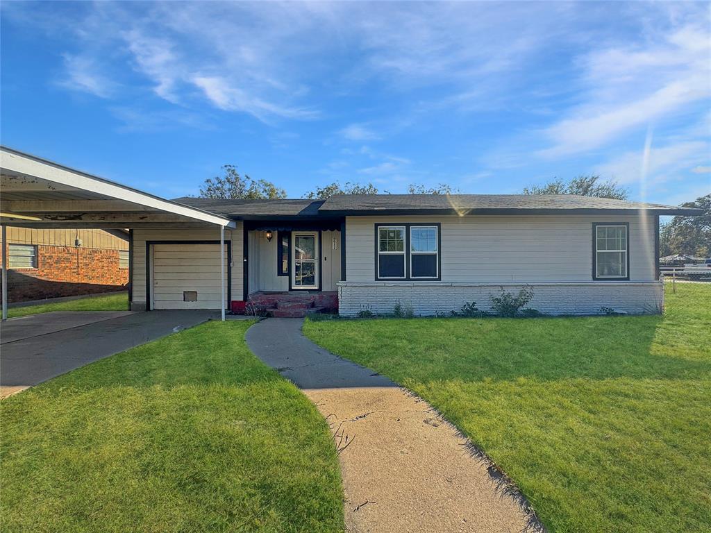 a view of a house with a back yard