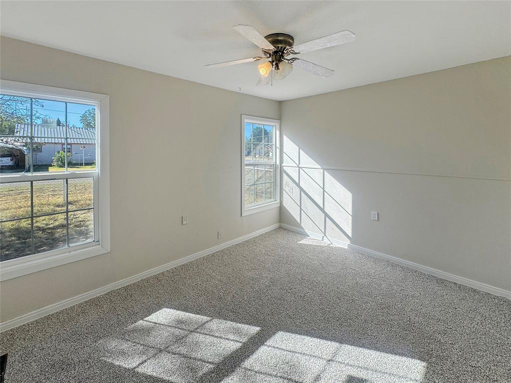 211 Oak Street Roscoe, TX 79545 - Photo 13 of 22 a view of an empty room with a window