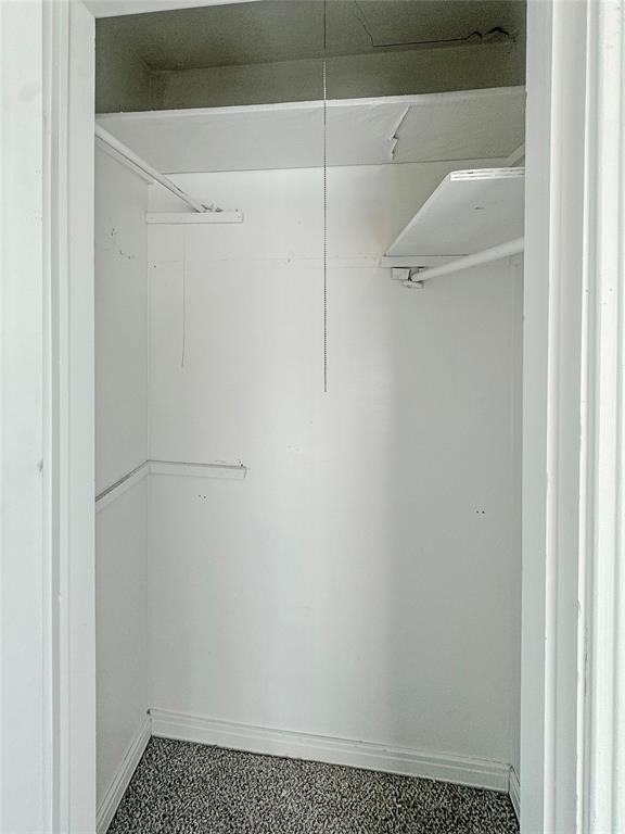 211 Oak Street Roscoe, TX 79545 - Photo 14 of 22 a bathroom with a glass shower door