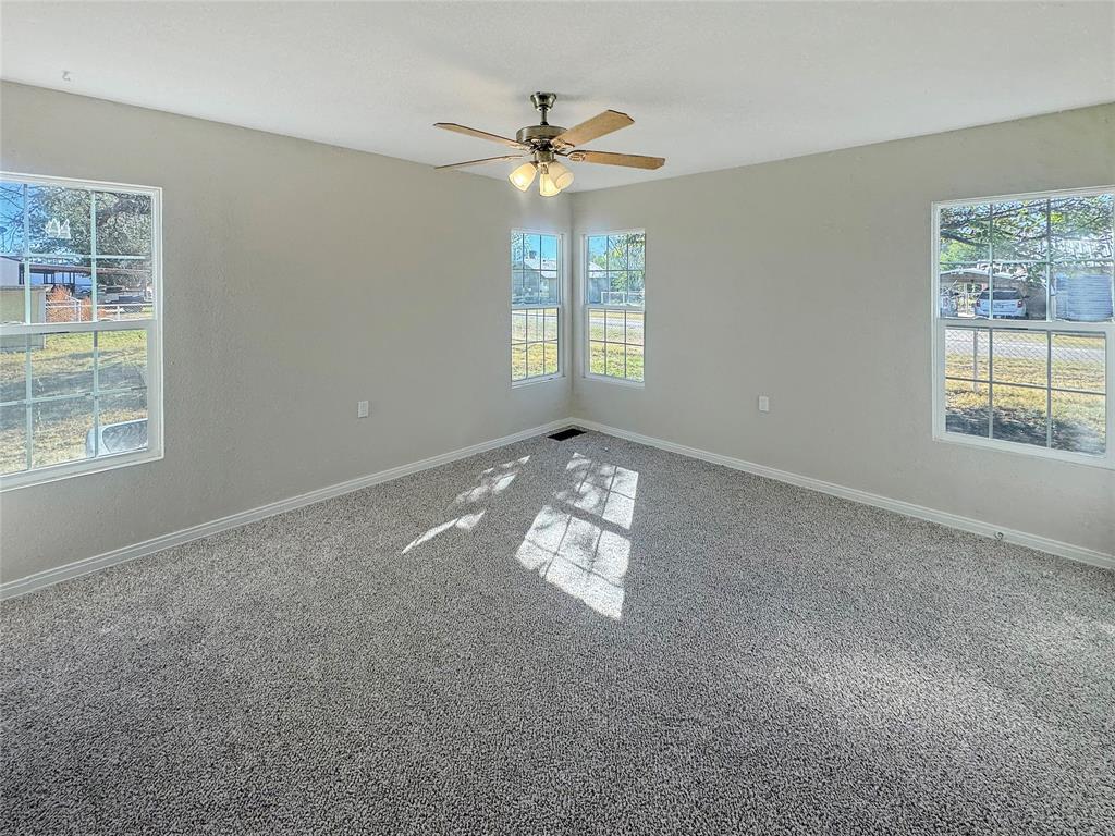 211 Oak Street Roscoe, TX 79545 - Photo 17 of 22 a view of an empty room with a window