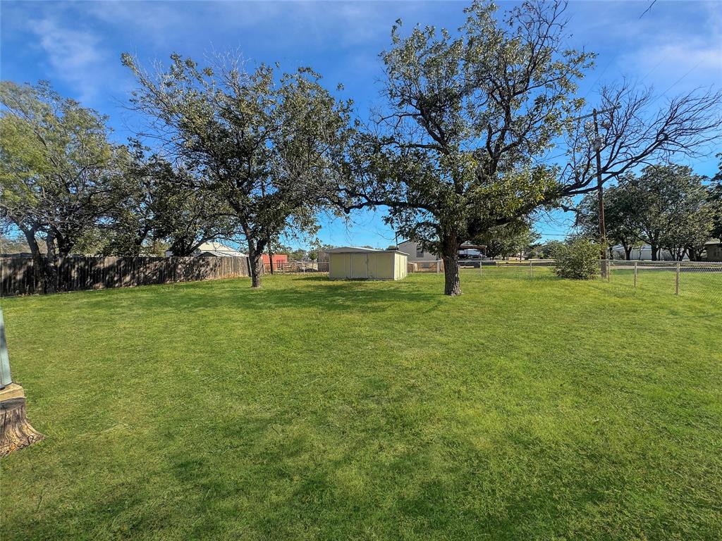 211 Oak Street Roscoe, TX 79545 - Photo 5 of 22 a view of pool with garden