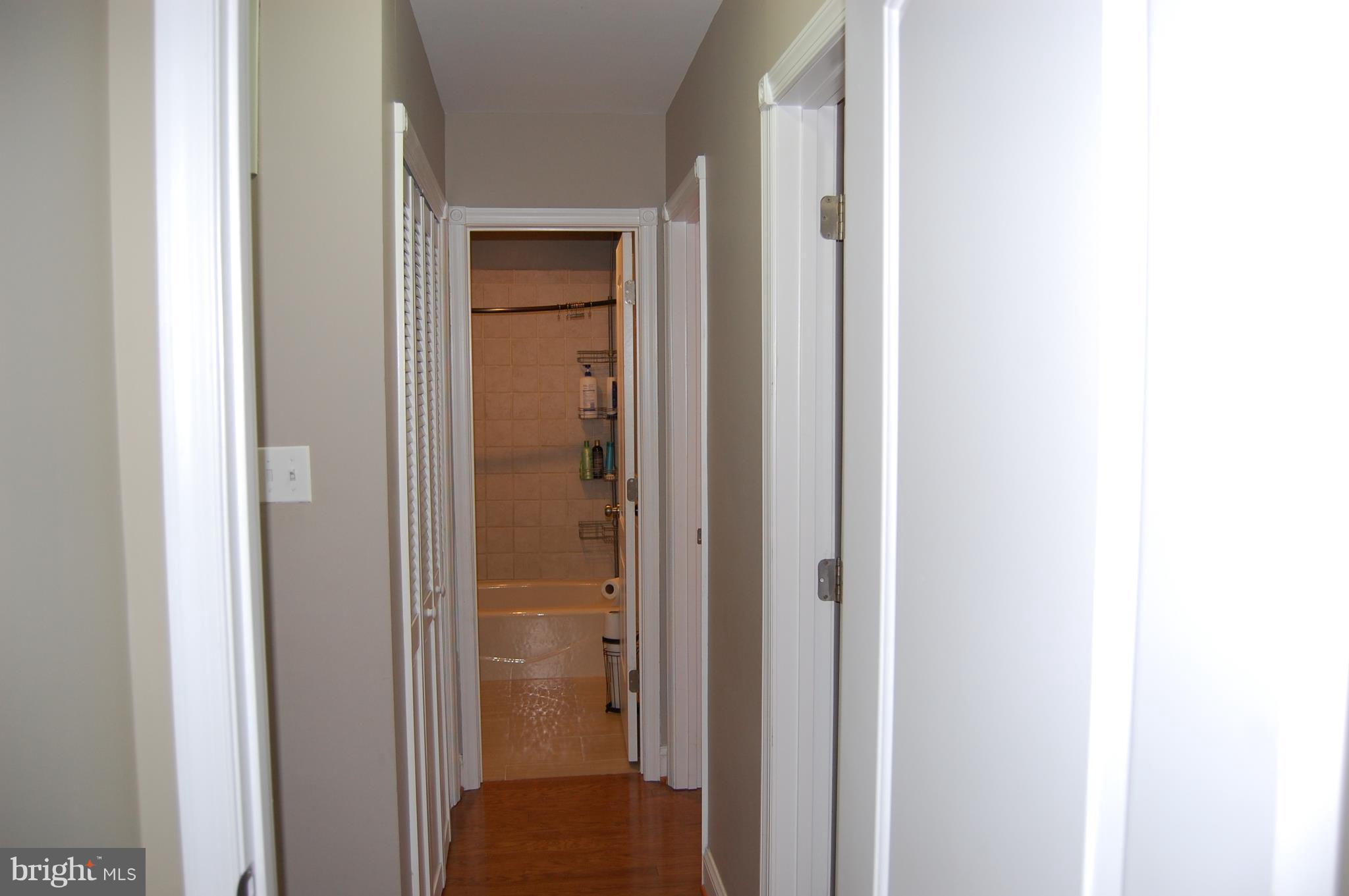 912 Lindsay Road Oxon Hill, MD 20745 - Photo 17 of 27 Hall to bedrooms and bath with tub and shower