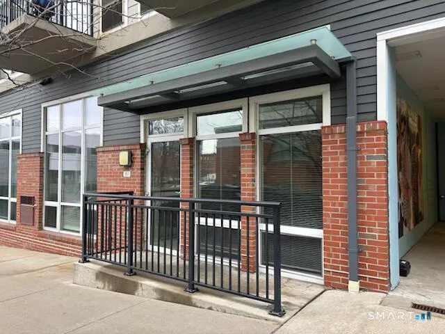 a view of a brick house with a large window