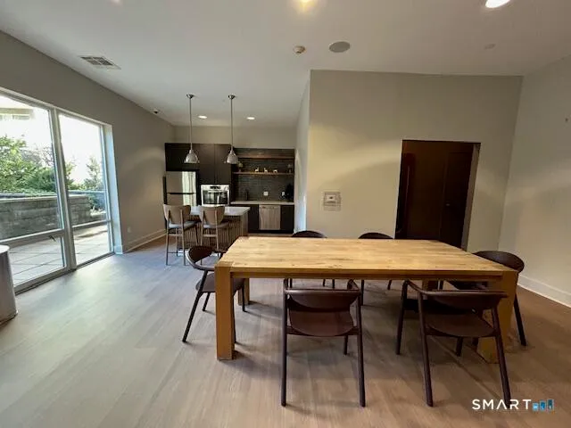 a view of a dining room with furniture window and outside view