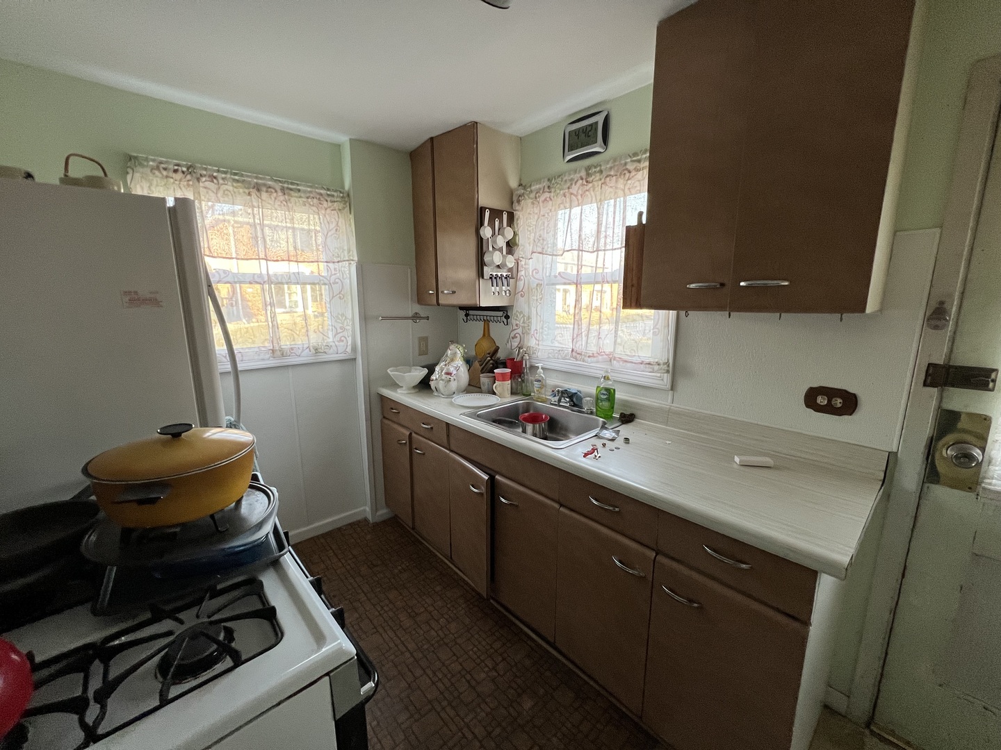 21 McCarthy Road Park Forest, IL 60466 - Photo 9 of 26 a kitchen with a sink stove and cabinets