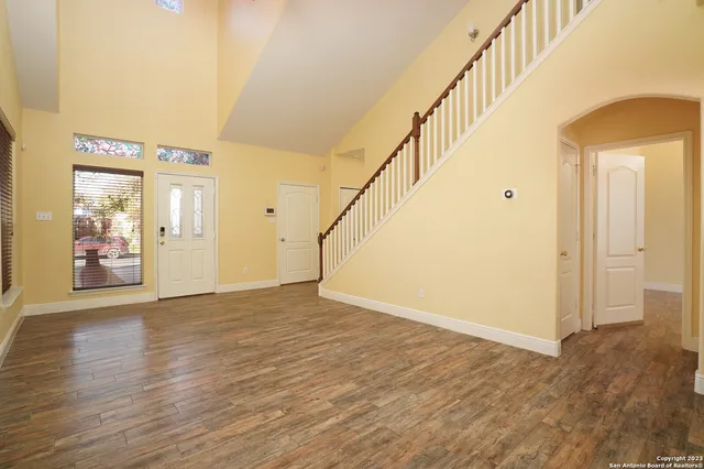 a view of an entryway with wooden floor