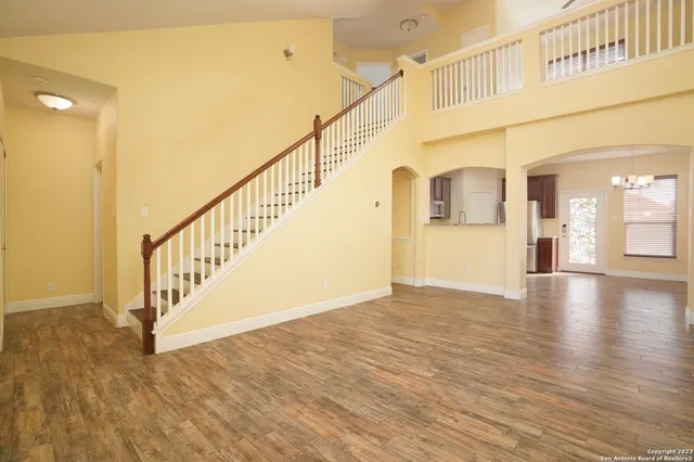 a view of an entryway with wooden floor