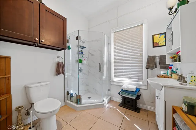 a bathroom with a toilet a sink and bathtub