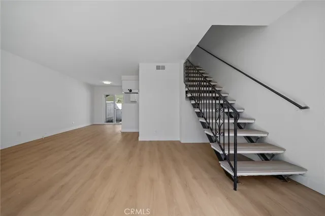 a view of entryway with wooden floor