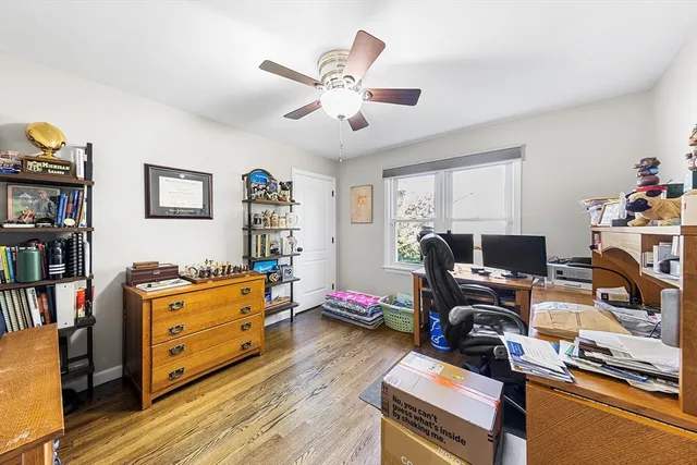 a workspace with furniture and wooden floor