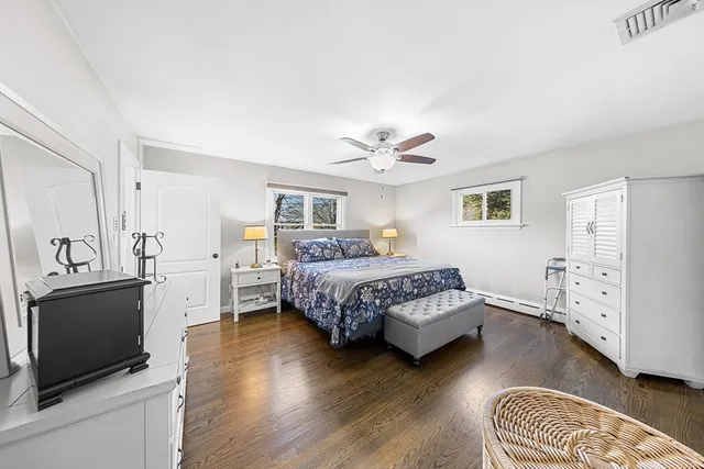 a bedroom with a bed and a television