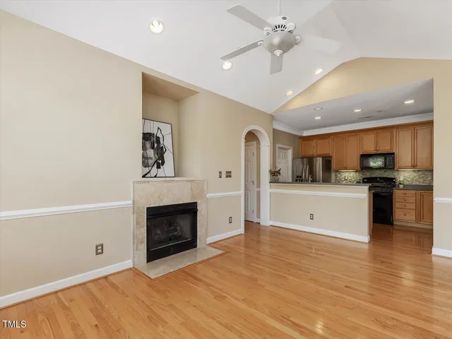 a view of kitchen with a sink and a fireplace