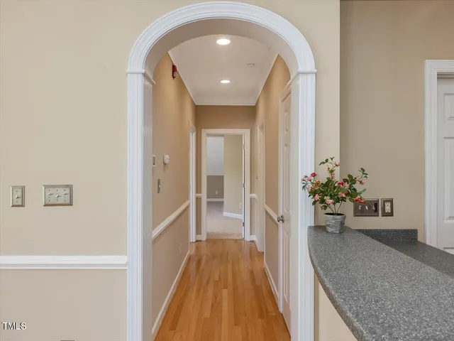 a view of a hallway view with wooden floor and staircase