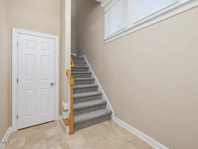 a bathroom with a window and a chandelier
