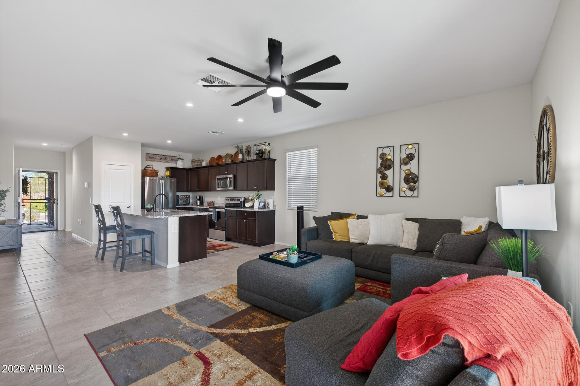 9573 Cotton Road Florence, AZ 85132 - Photo 10 of 46 a living room with furniture and kitchen view