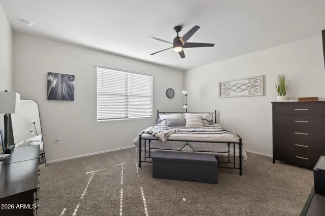 a living room with stainless steel appliances kitchen island a table and chairs in it