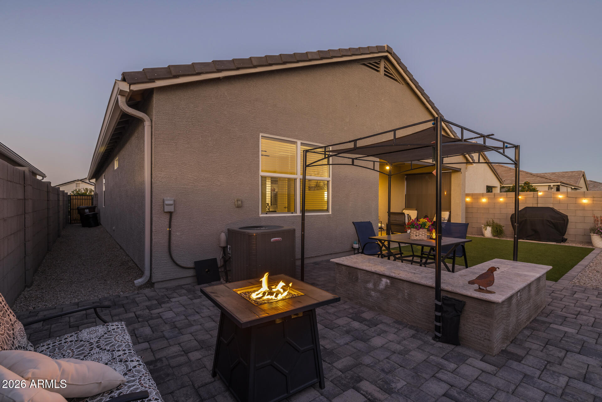 9573 Cotton Road Florence, AZ 85132 - Photo 25 of 46 a backyard of a house with fountain table and chairs