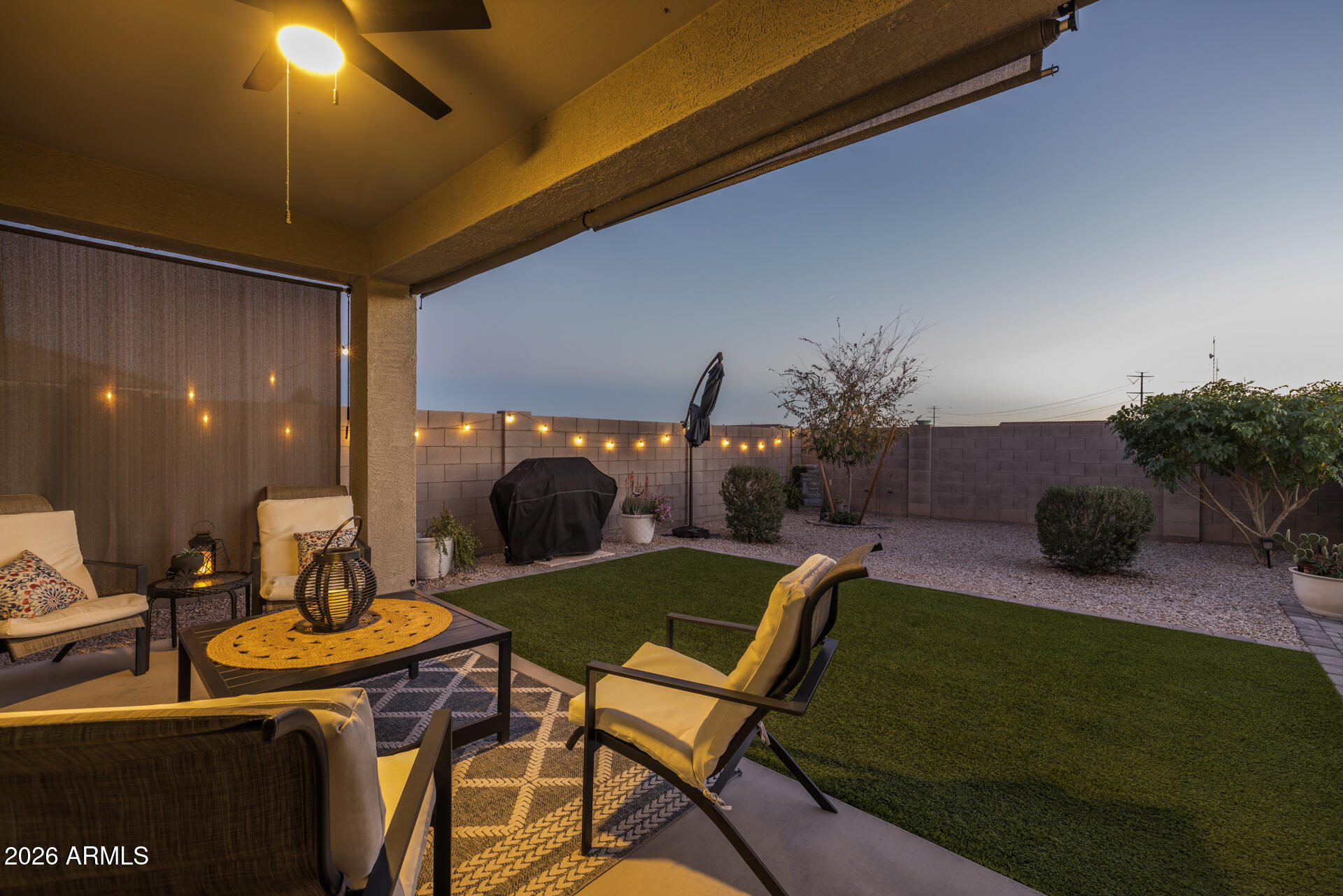9573 Cotton Road Florence, AZ 85132 - Photo 28 of 46 a living room with furniture and a fireplace