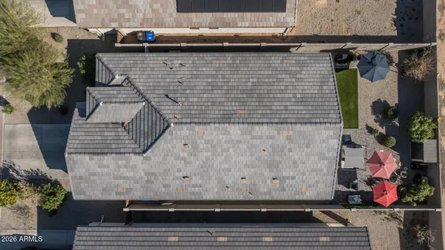 an aerial view of a house with a garden and plants