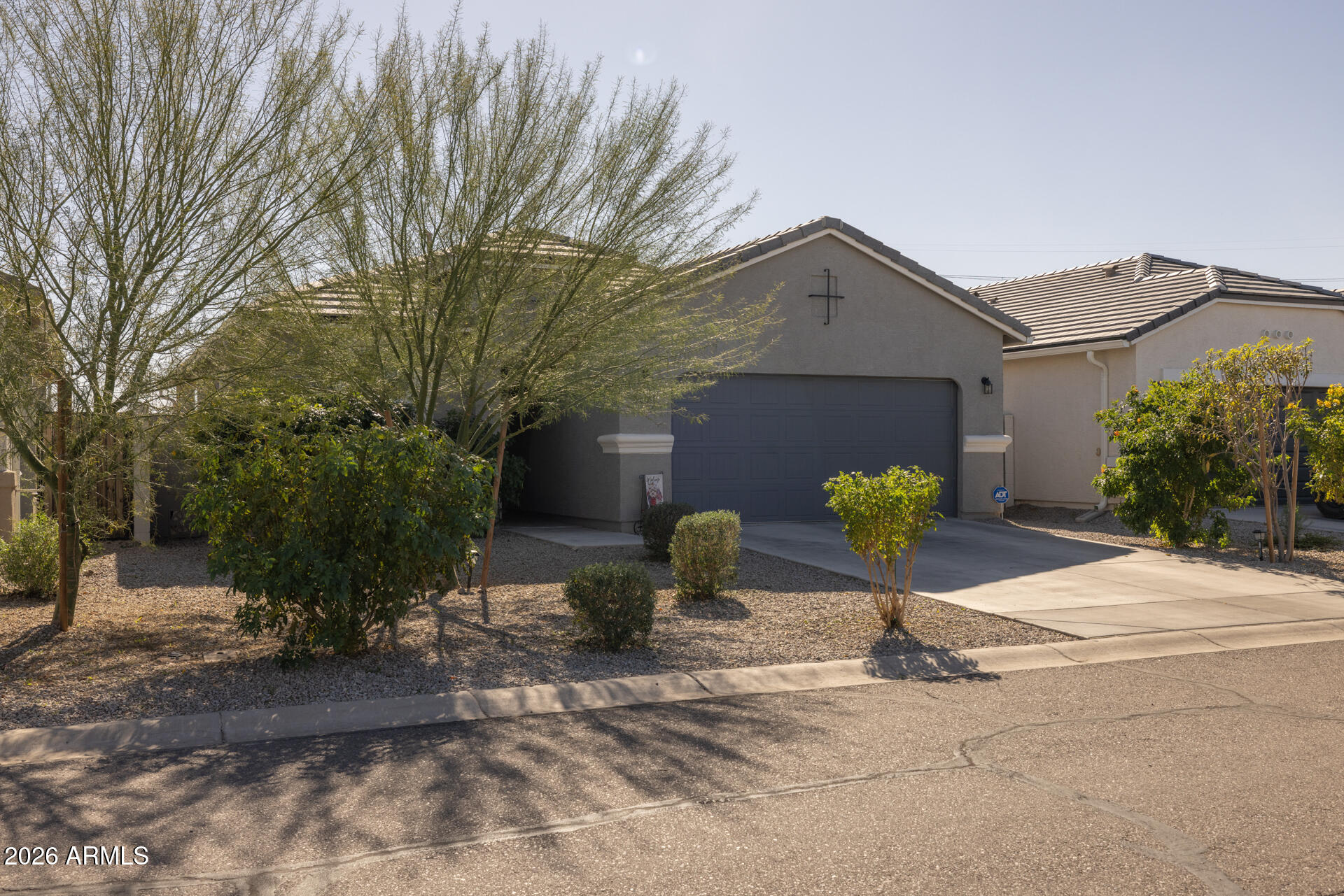 9573 Cotton Road Florence, AZ 85132 - Photo 6 of 46 a front view of a house with a yard and garage