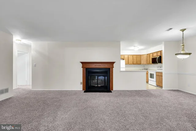 a view of a livingroom and a fireplace