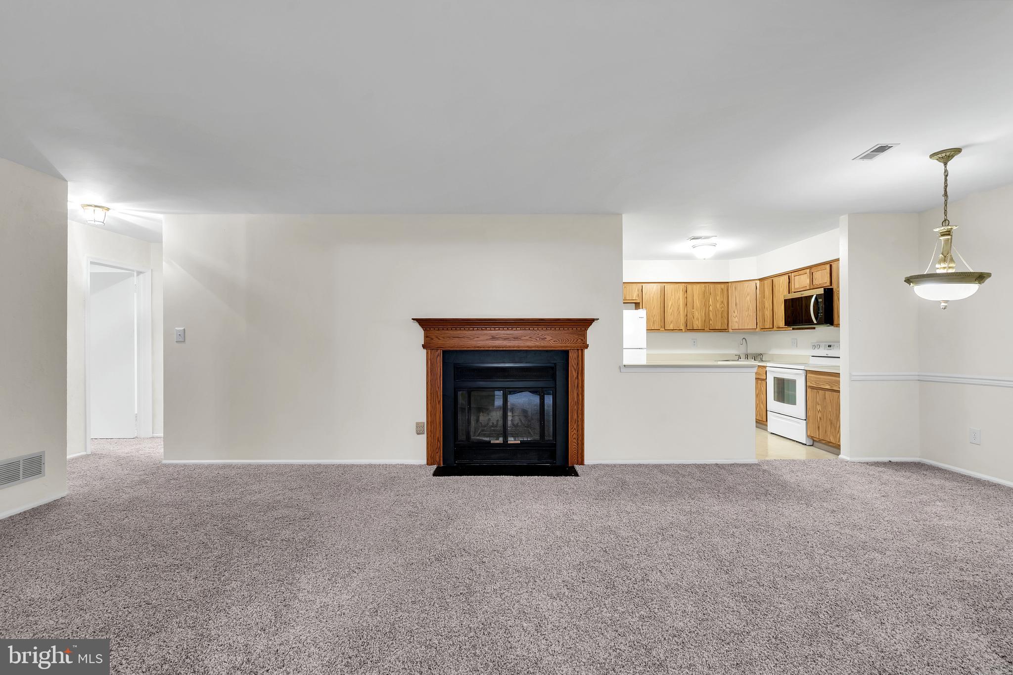 a view of a livingroom and a fireplace