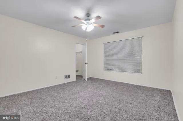 a view of an empty walk in closet