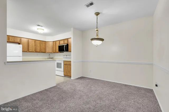 a view of a kitchen with a sink and dishwasher