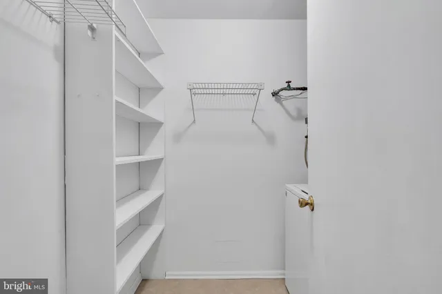 a view of staircase with white walls