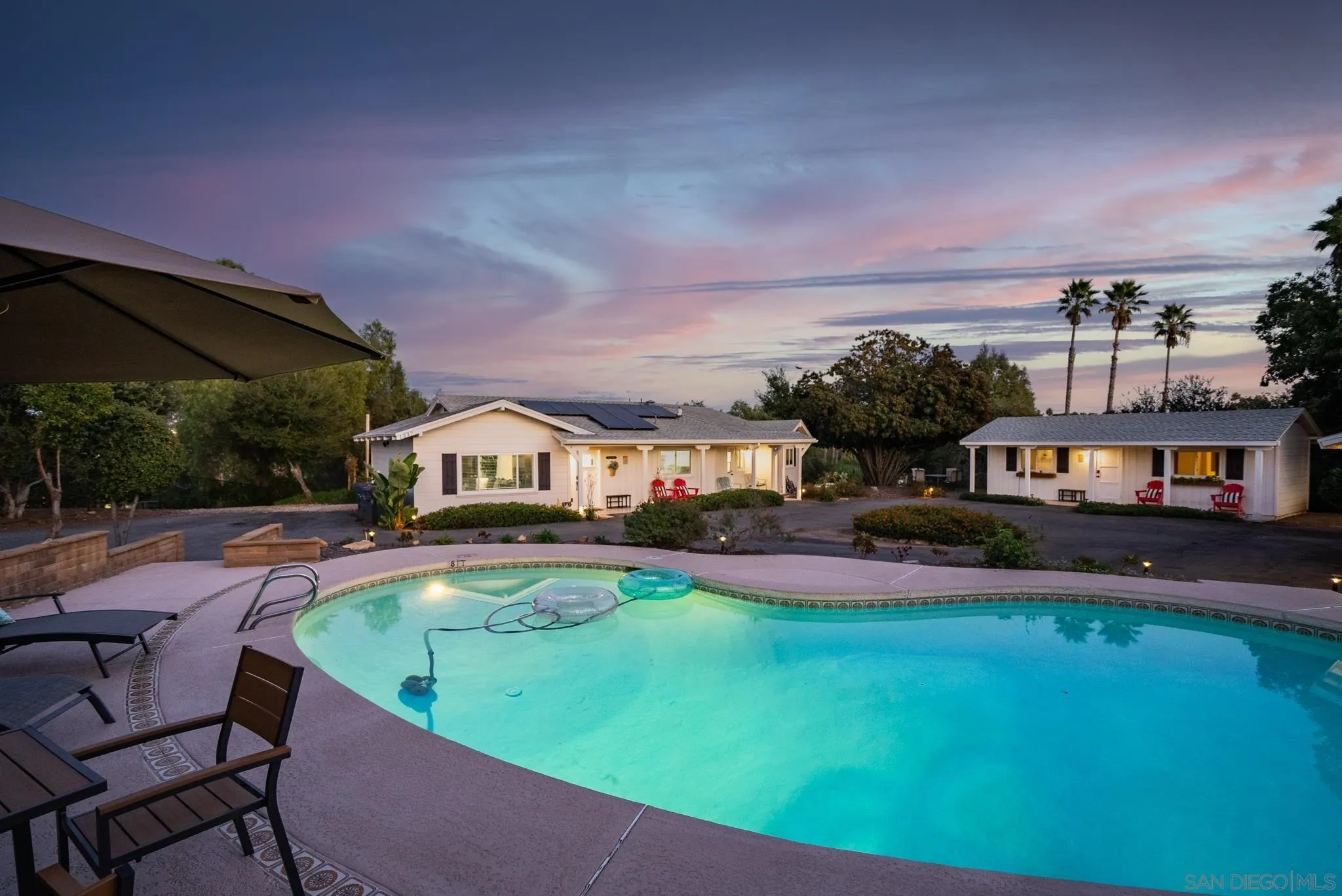 1337 Friends Way Fallbrook, CA 92028 - Photo 6 of 74 a front view of a house with swimming pool having outdoor seating