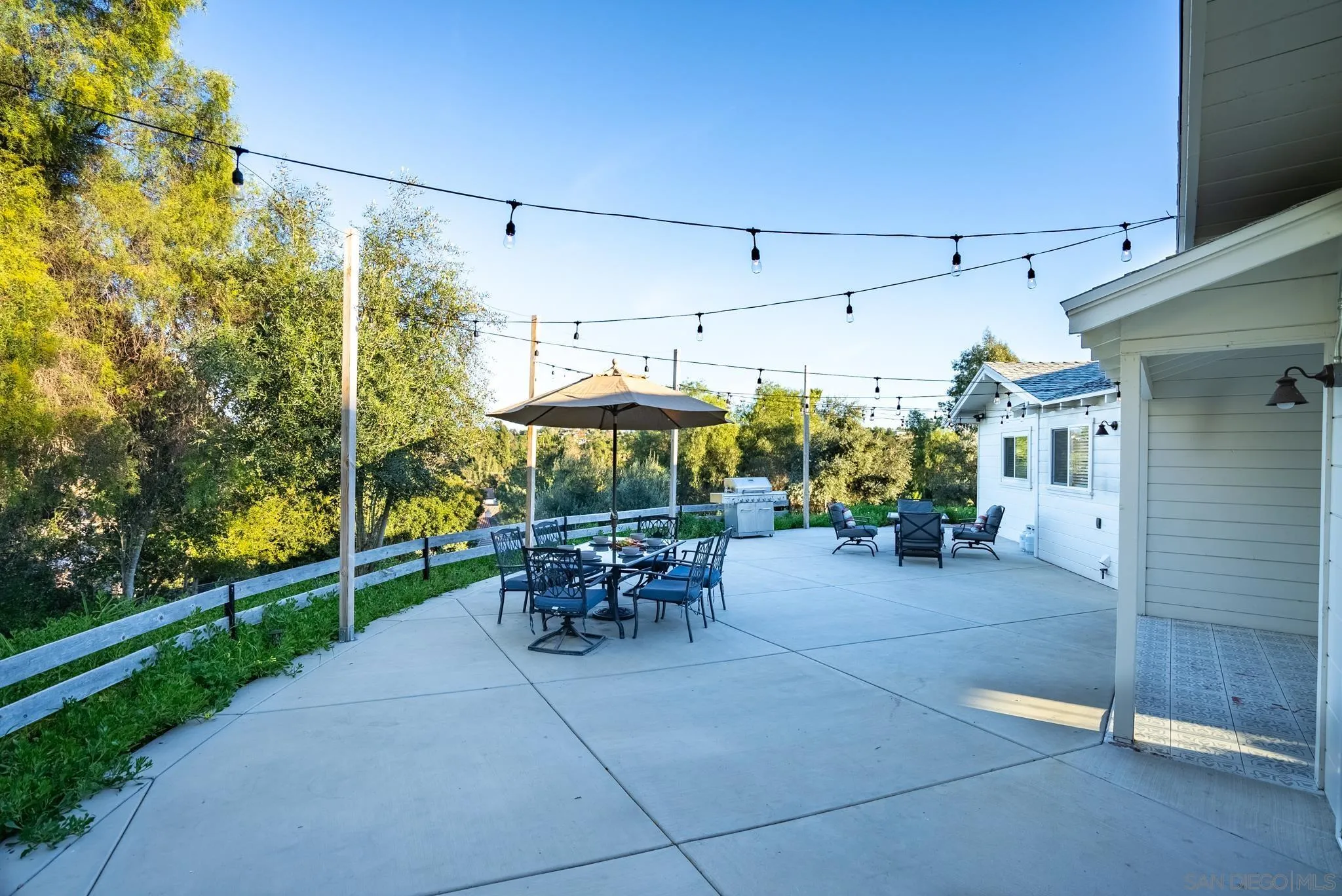 1337 Friends Way Fallbrook, CA 92028 - Photo 69 of 74 a view of a patio with a table and chairs under an umbrella