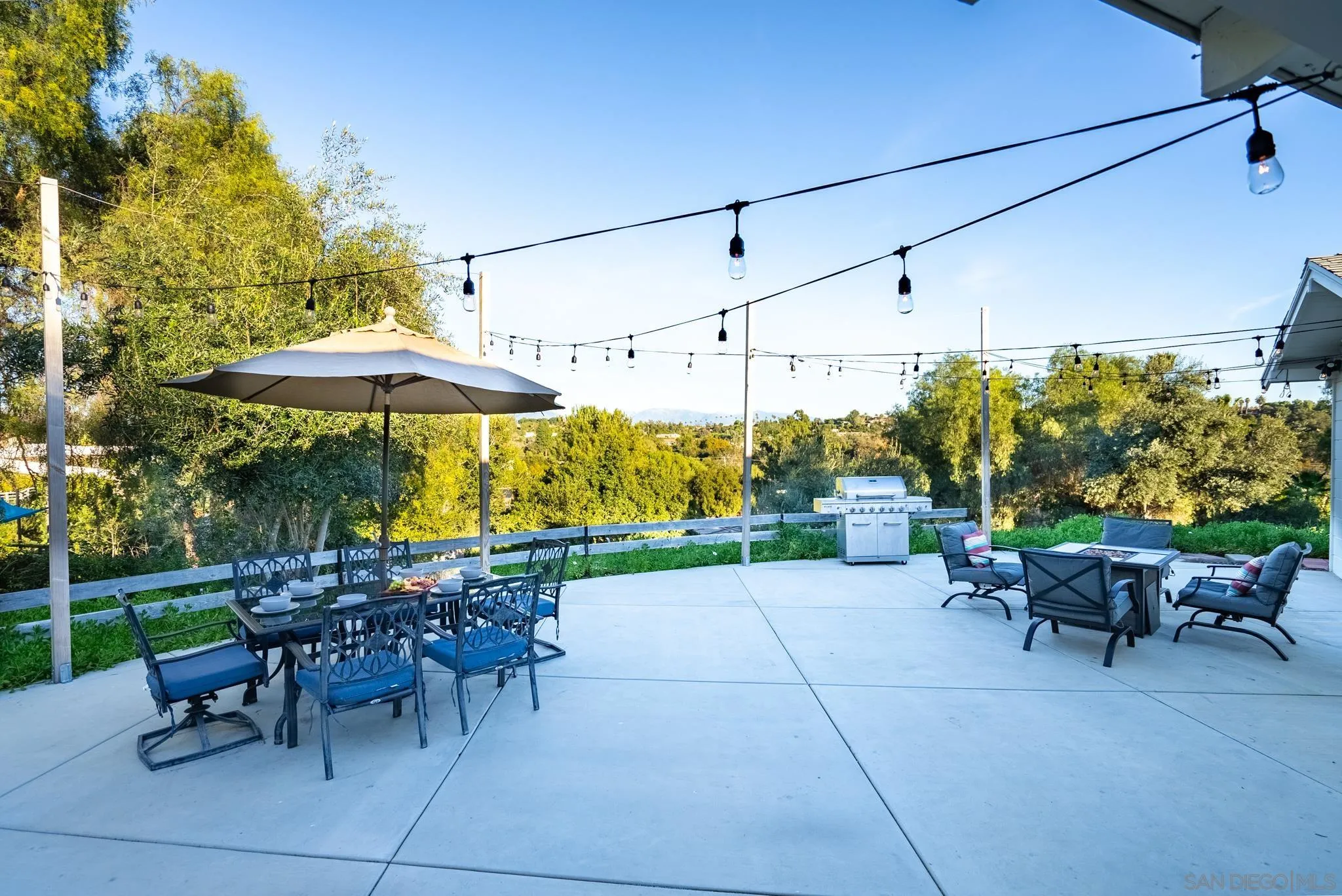 1337 Friends Way Fallbrook, CA 92028 - Photo 71 of 74 a view of a patio with a table and chairs under an umbrella