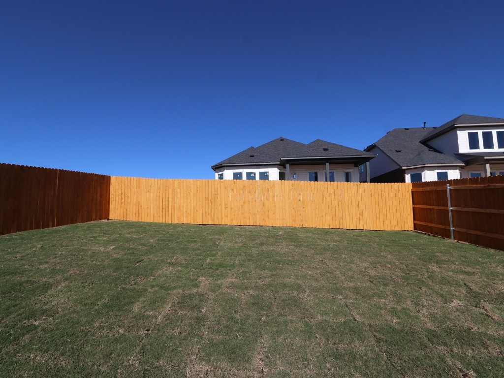 226 Grayson Elm Pass Dripping Springs, TX 78620 - Photo 16 of 23 a view of an outdoor space and a yard