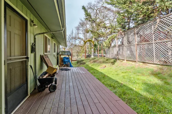 a view of outdoor space with deck and hardwood