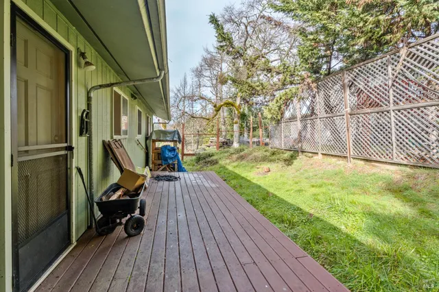 a view of outdoor space with deck and hardwood
