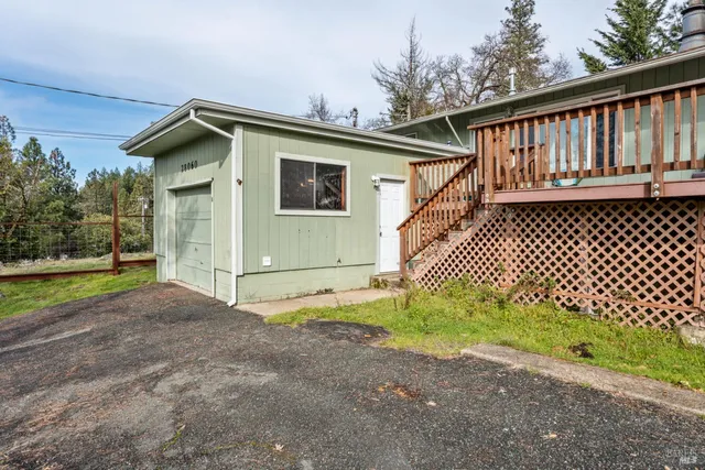 a house with trees in the background